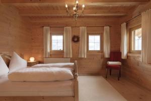 Voodi või voodid majutusasutuse Alpen-Chalet-Pankraz toas