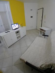 Ένα ή περισσότερα κρεβάτια σε δωμάτιο στο Miramar