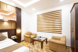 Postel nebo postele na pokoji v ubytování Hotel Panickers Residency - Ajmal Khan Market Near Karol Bagh Metro
