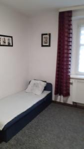 Posteľ alebo postele v izbe v ubytovaní Apartament LORD