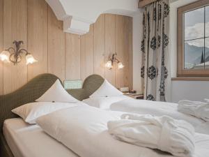 Łóżko lub łóżka w pokoju w obiekcie Apparthotel "Landhaus Veronika"