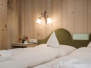 Łóżko lub łóżka w pokoju w obiekcie Apparthotel "Landhaus Veronika"