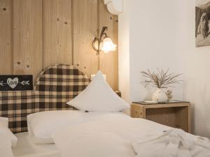 Łóżko lub łóżka w pokoju w obiekcie Apparthotel "Landhaus Veronika"