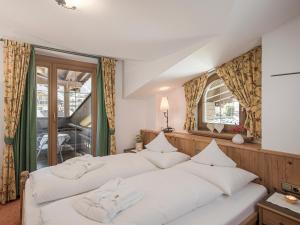Łóżko lub łóżka w pokoju w obiekcie Apparthotel "Landhaus Veronika"