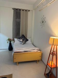 Postel nebo postele na pokoji v ubytování Ava Homestay