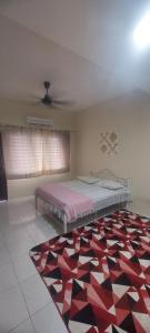 En eller flere senge i et værelse på Salak Lestari Homestay