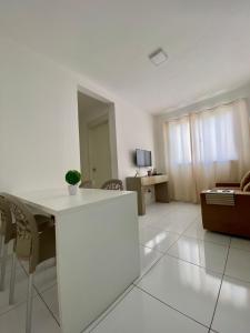 a white living room with a white table and chairs at Ap da Thay - Arretado in Campina Grande +26 photos