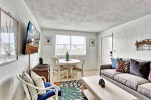a living room with a couch and a table at Friendly Native 204 in St Pete Beach