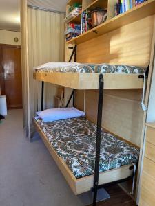 a couple of bunk beds in a room at Sestriere Gem Comfy Apartment with Ski Views in Sestriere