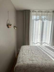 Postel nebo postele na pokoji v ubytování Chambre chez l'habitant proche de paris
