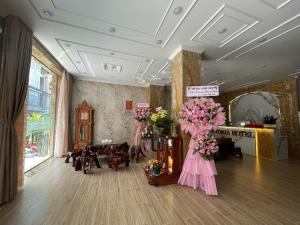 a room with flowers on display in a store at VICTORIA hotel in Can Tho