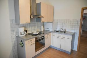 Kuchyň nebo kuchyňský kout v ubytování Ferienwohnung Maris
