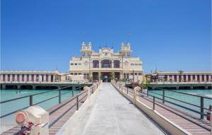 a building on a pier next to the water at Mono 2 in Lido di Mondello +17 photos