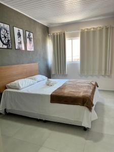 Postel nebo postele na pokoji v ubytování LOFT PAJUMAR 1 ANDAR 300mt PRAIA PAJUCARA