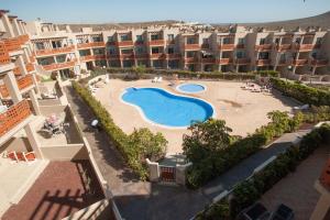 an aerial view of an apartment complex with a swimming pool at Vista Roja in El Médano