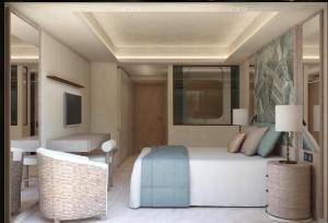 a bedroom with a bed and a table and a chair at Rodos Park in Rhodes Town