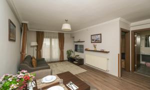 TV a/nebo společenská místnost v ubytování Belle Maison Hotel&Residence