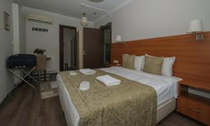 Postel nebo postele na pokoji v ubytování Belle Maison Hotel&Residence