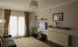 TV a/nebo společenská místnost v ubytování Belle Maison Hotel&Residence