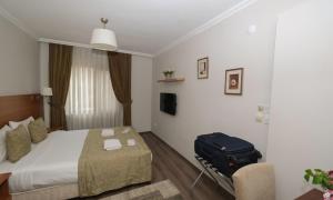 Postel nebo postele na pokoji v ubytování Belle Maison Hotel&Residence