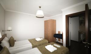 Postel nebo postele na pokoji v ubytování Belle Maison Hotel&Residence