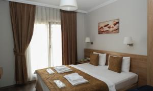 Postel nebo postele na pokoji v ubytování Belle Maison Hotel&Residence