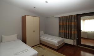 Postel nebo postele na pokoji v ubytování Belle Maison Hotel&Residence