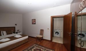 Postel nebo postele na pokoji v ubytování Belle Maison Hotel&Residence