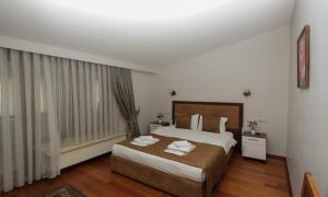 Postel nebo postele na pokoji v ubytování Belle Maison Hotel&Residence