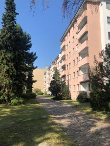 an empty street in front of a building at Boardinghouse Hohenzollern in Berlin
