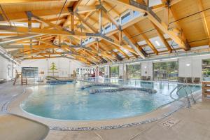 a large indoor swimming pool in a building at Killdeer - Unit 6 in Sunriver