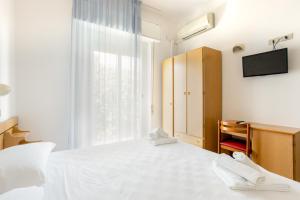 Postel nebo postele na pokoji v ubytování Hotel Katina