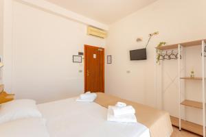Postel nebo postele na pokoji v ubytování Hotel Katina