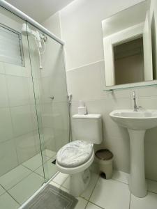 a bathroom with a toilet and a sink and a shower at Ap da Thay - Os Três Pandeiros in Campina Grande