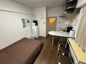 Η κουζίνα ή μικρή κουζίνα στο Guest House Ropponmatsu INN +24 φωτογραφίες