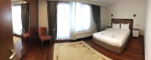 Postel nebo postele na pokoji v ubytování Belle Maison Hotel&Residence