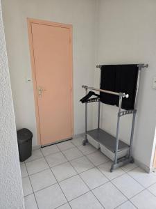 a room with a treadmill next to a door at Chambre indépendante in Les Avenières