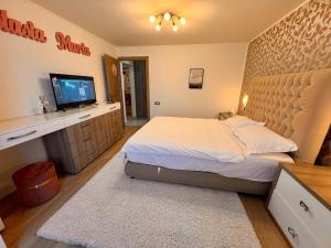 Ένα ή περισσότερα κρεβάτια σε δωμάτιο στο A&A Apartment