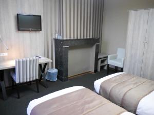 Postel nebo postele na pokoji v ubytování Hotel Mille Colonnes