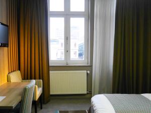 Letto o letti in una camera di Hotel Mille Colonnes