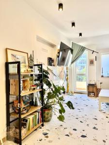 a room with a book shelf with an umbrella at Lovemate space in Varna City