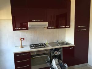 Køkken eller tekøkken på Appartamento Romeo + 2 billeder