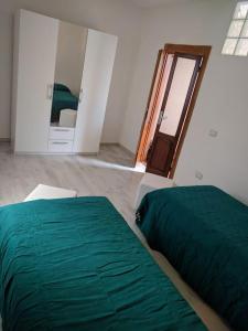 Postel nebo postele na pokoji v ubytování Appartamento Bosa + 4 fotografie