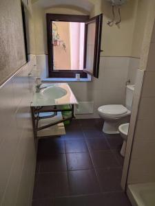 Koupelna v ubytování Appartamento Bosa