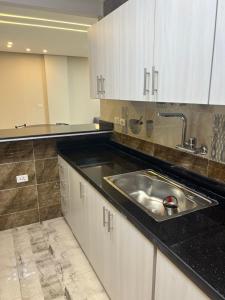Dapur atau dapur kecil di Elhosary apartment