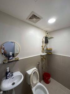 a bathroom with a sink and a toilet and a mirror at Noble Villa in Pila +20 photos