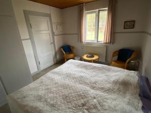 Postel nebo postele na pokoji v ubytování GRUBBE MØLLE Bed & Breakfast