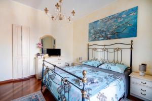 a bedroom with a bed and a chandelier at Approdo Sul Mare Bari Apartment in Bari