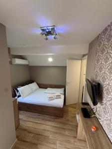 Postel nebo postele na pokoji v ubytování Bed & Coffee LUKAS Krusevac
