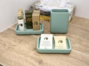 two trays of products sitting on a wooden table at Trotto e Galoppo Rooms in Arezzo